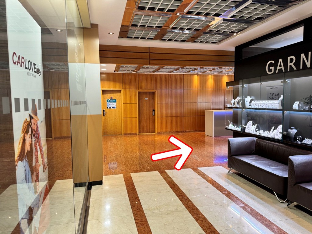 Once you got a key, exit the office and head to the hotel reception