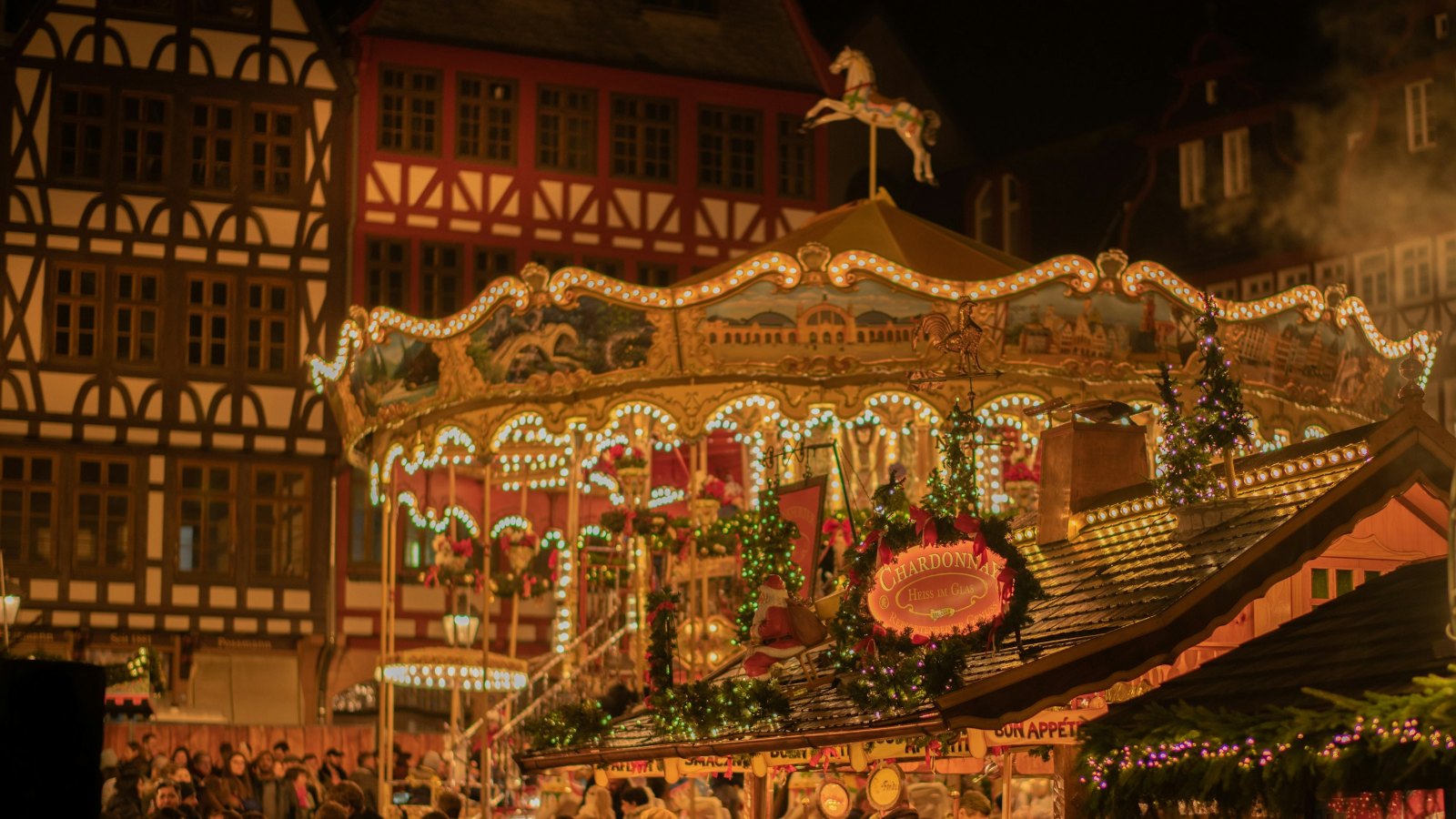 Illuminated carousel at a Christmas market