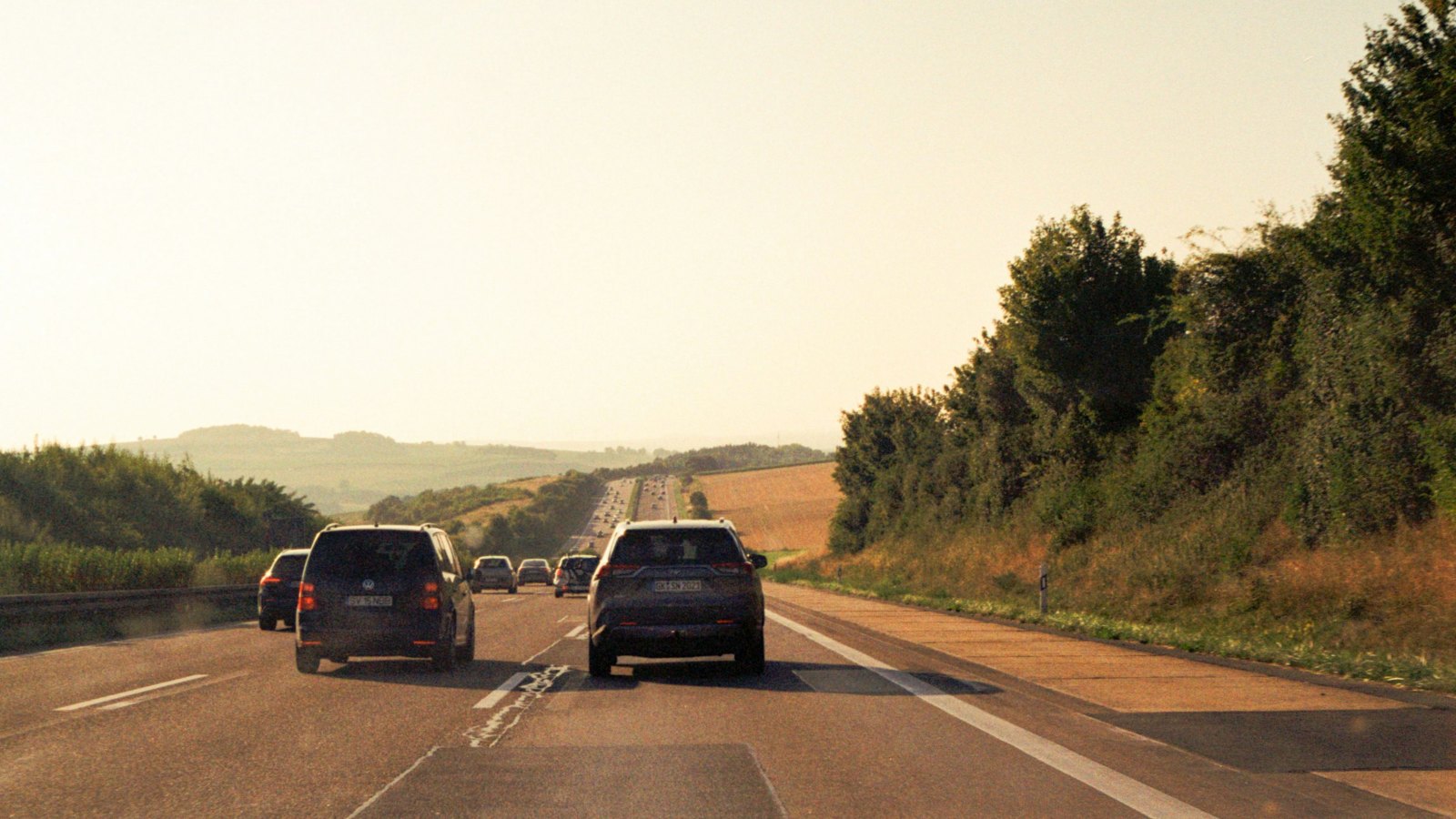 Cars driving on a motorway in warm evening light